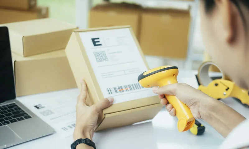 Scanning a parcel barcode at the packing bench